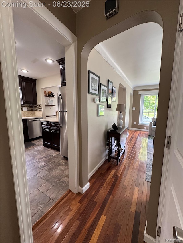 4235 Bacon Ave, Berkley, MI 48072 - hallway featuring arched walkways and dark wood finished floors