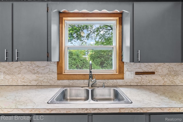 1059 Morris Hills Pkwy, Mount Morris, MI 48458 - kitchen featuring gray cabinets, light countertops, and tasteful backsplash