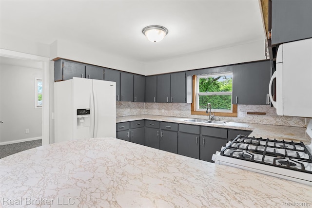 1059 Morris Hills Pkwy, Mount Morris, MI 48458 - kitchen with white appliances, tasteful backsplash, and gray cabinetry