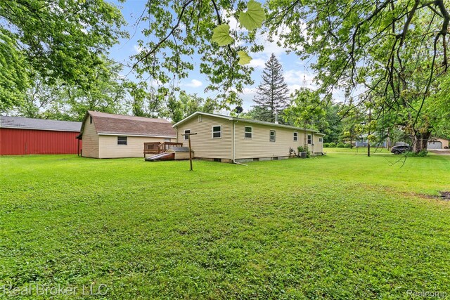 1059 Morris Hills Pkwy, Mount Morris, MI 48458 - rear view of property featuring a yard