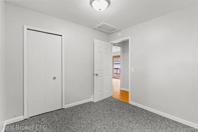 1059 Morris Hills Pkwy, Mount Morris, MI 48458 - unfurnished bedroom featuring attic access, carpet flooring, and a closet