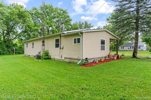 1059 Morris Hills Pkwy, Mount Morris, MI 48458 - view of home's exterior with a yard and a cooling unit