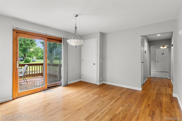 1059 Morris Hills Pkwy, Mount Morris, MI 48458 - unfurnished dining area featuring light wood-style flooring and ceiling fan