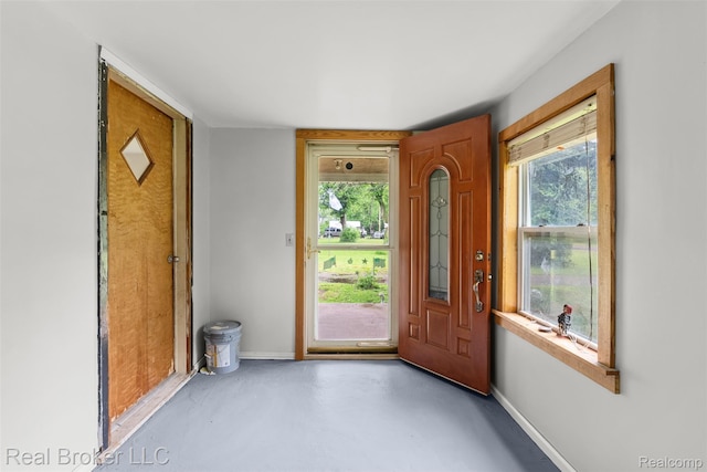 1059 Morris Hills Pkwy, Mount Morris, MI 48458 - foyer entrance with concrete flooring and plenty of natural light