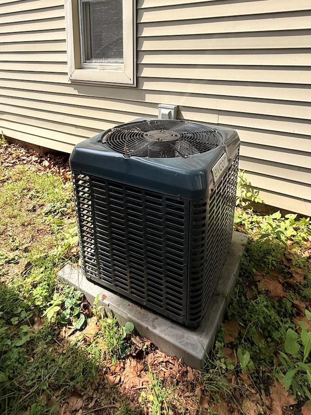 209 Sarah St, Adrian, MI 49221 - exterior view of a central AC unit