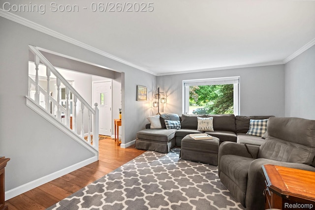 4386 Kelly Circle Dr, Commerce Twp, MI 48390 - living area featuring crown molding, wood finished floors, and stairway
