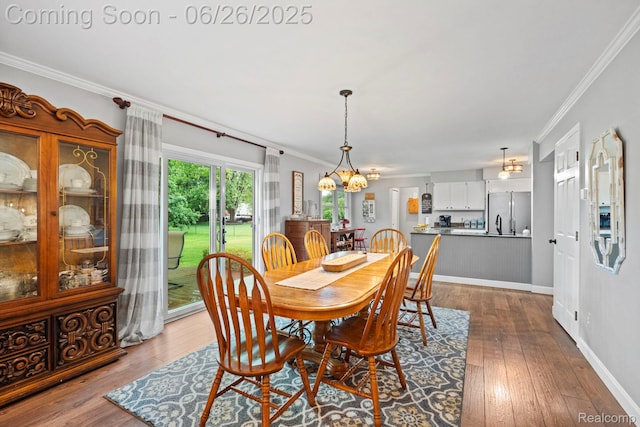 4386 Kelly Circle Dr, Commerce Twp, MI 48390 - dining room featuring a chandelier, dark wood finished floors, and ornamental molding