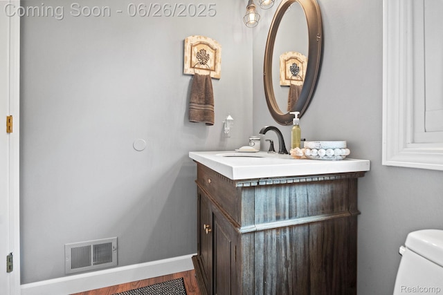4386 Kelly Circle Dr, Commerce Twp, MI 48390 - bathroom featuring vanity and toilet