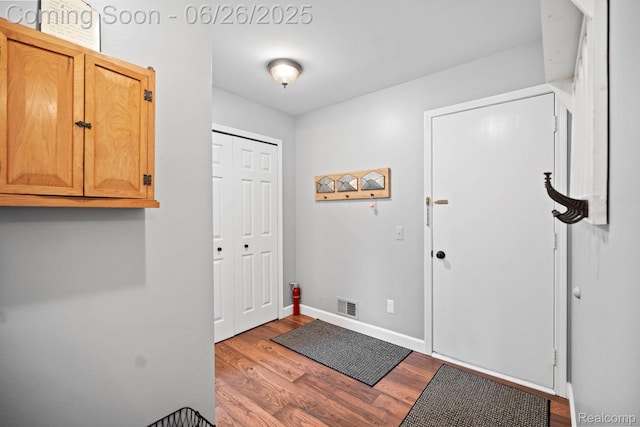 4386 Kelly Circle Dr, Commerce Twp, MI 48390 - entryway with wood finished floors and baseboards