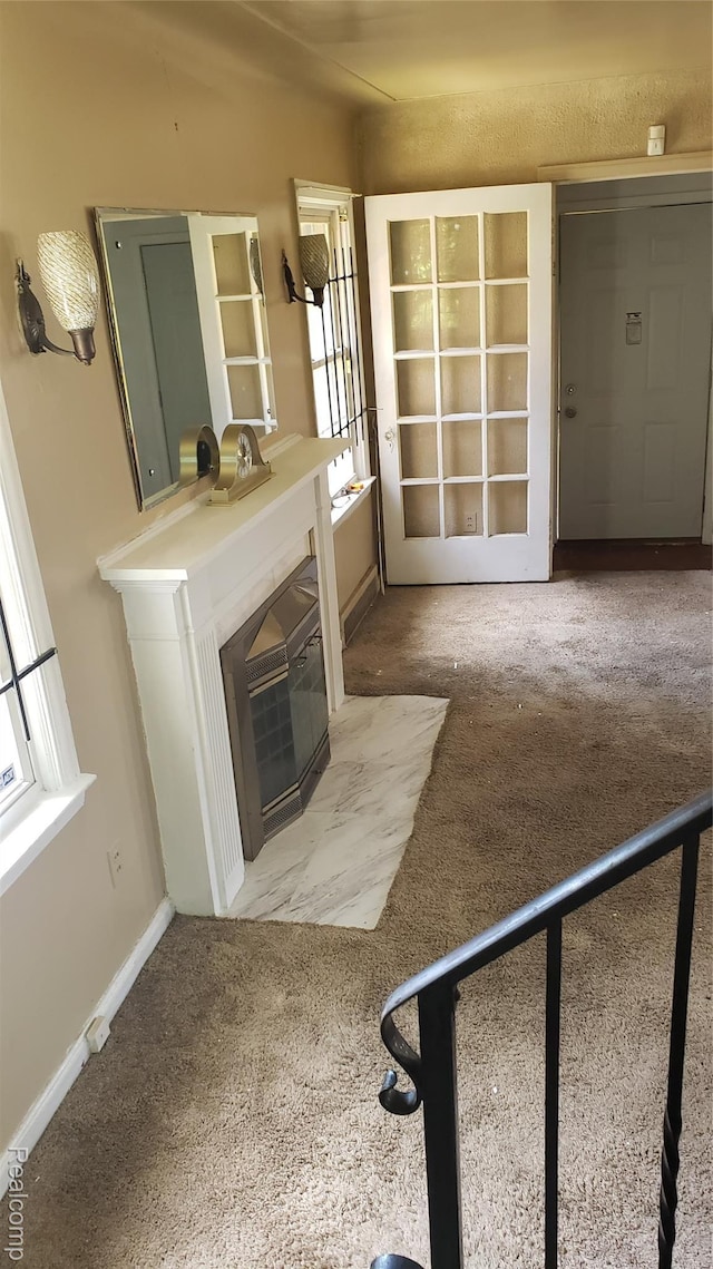 18968 Asbury Park, Detroit, MI 48235 - unfurnished living room featuring carpet and a fireplace with flush hearth