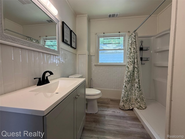 21738 Evergreen St, Saint Clair Shores, MI 48082 - bathroom with wood finished floors, curtained shower, vanity, and ornamental molding