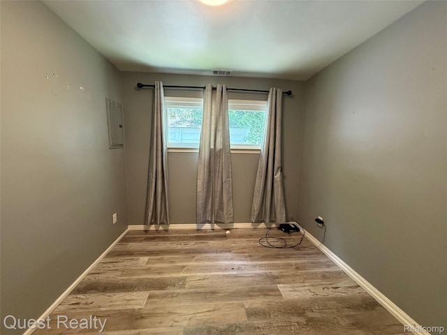 21738 Evergreen St, Saint Clair Shores, MI 48082 - empty room with wood finished floors and electric panel