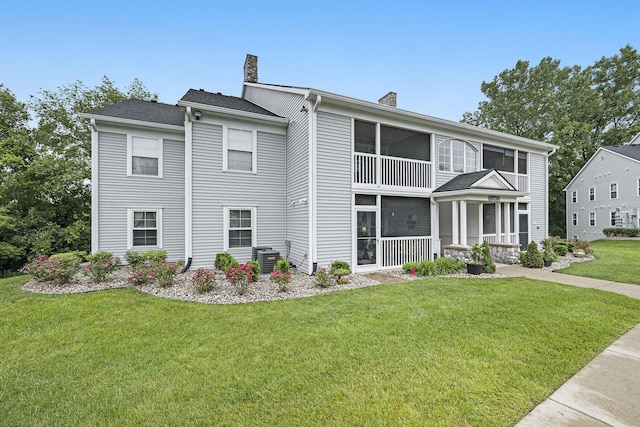 4219 Inverness St Unit 118, Dexter, MI 48130 - view of front facade with a chimney and a front lawn