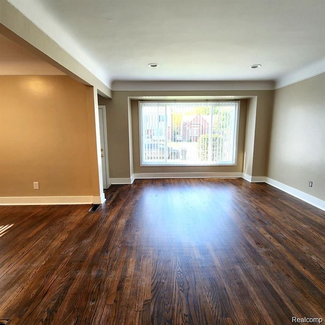 16598 Biltmore St, Detroit, MI 48235 - unfurnished room with baseboards and dark wood-type flooring