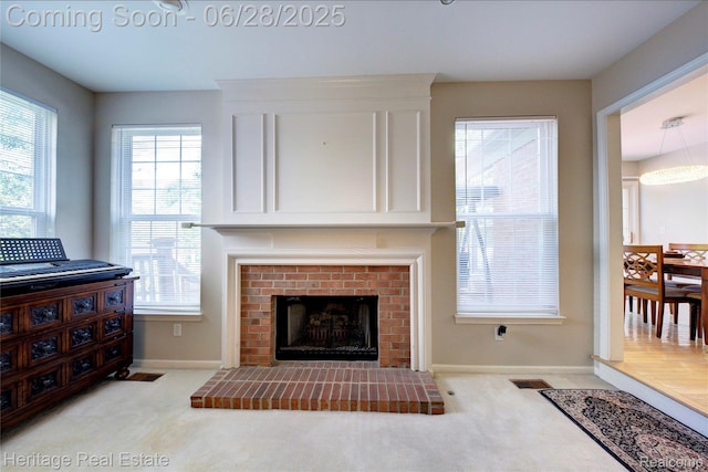 3400 Yosemite Dr, Lake Orion, MI 48360 - living area with carpet floors and a fireplace