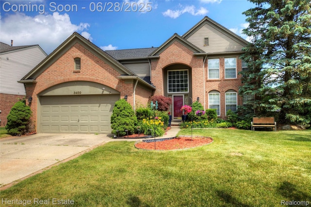 3400 Yosemite Dr, Lake Orion, MI 48360 - traditional home featuring brick siding, a front lawn, driveway, and a garage