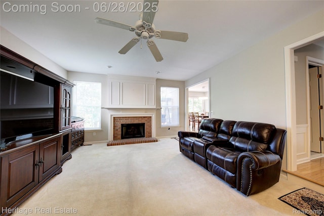 3400 Yosemite Dr, Lake Orion, MI 48360 - living area featuring ceiling fan, light colored carpet, and a fireplace
