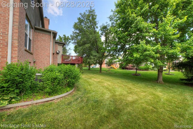 3400 Yosemite Dr, Lake Orion, MI 48360 - view of grassy yard featuring a deck