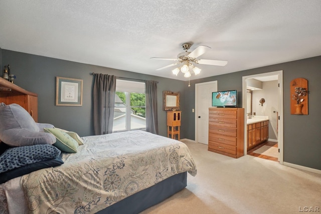 221 Burt St, Tecumseh, MI 49286 - bedroom with light colored carpet, a textured ceiling, a ceiling fan, and ensuite bathroom