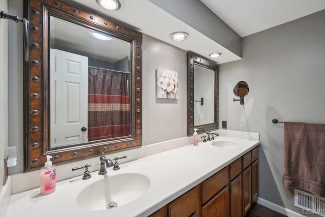 221 Burt St, Tecumseh, MI 49286 - full bathroom featuring double vanity and recessed lighting