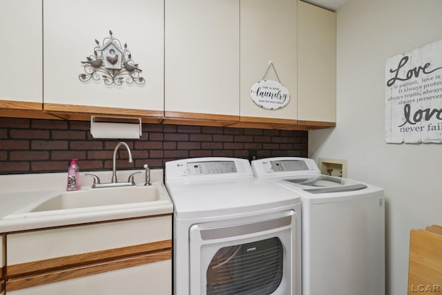 221 Burt St, Tecumseh, MI 49286 - laundry room with washer and dryer and cabinet space