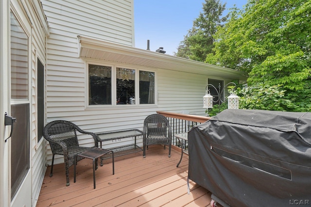 221 Burt St, Tecumseh, MI 49286 - wooden deck with a grill