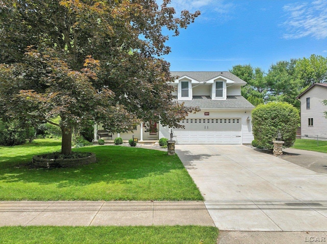 221 Burt St, Tecumseh, MI 49286 - view of front of house with driveway, a garage, and a front yard