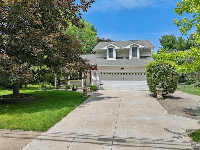 221 Burt St, Tecumseh, MI 49286 - view of front of house with driveway, a front yard, a garage, and roof with shingles