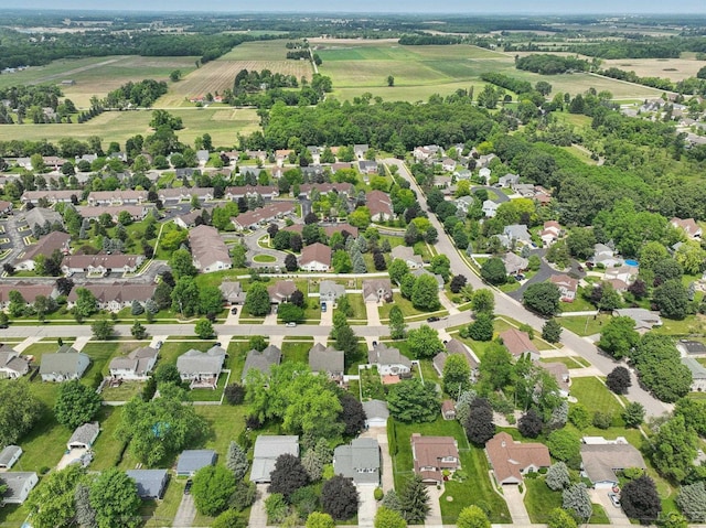 221 Burt St, Tecumseh, MI 49286 - aerial view of property's location with rural landscape, rows of crops, and nearby suburban area