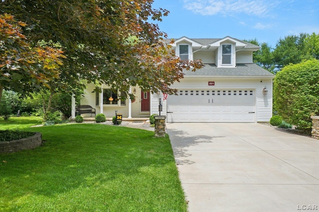221 Burt St, Tecumseh, MI 49286 - view of front facade with concrete driveway, a front lawn, and an attached garage
