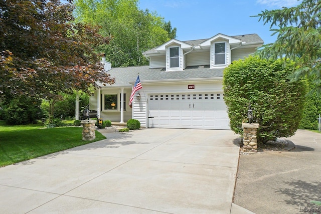 221 Burt St, Tecumseh, MI 49286 - view of front of home featuring driveway, a front lawn, roof with shingles, and a chimney