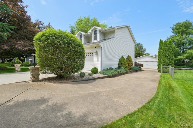 221 Burt St, Tecumseh, MI 49286 - view of home's exterior with a detached garage and an outdoor structure