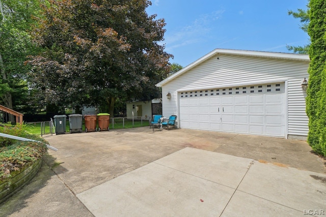 221 Burt St, Tecumseh, MI 49286 - view of property exterior featuring a garage