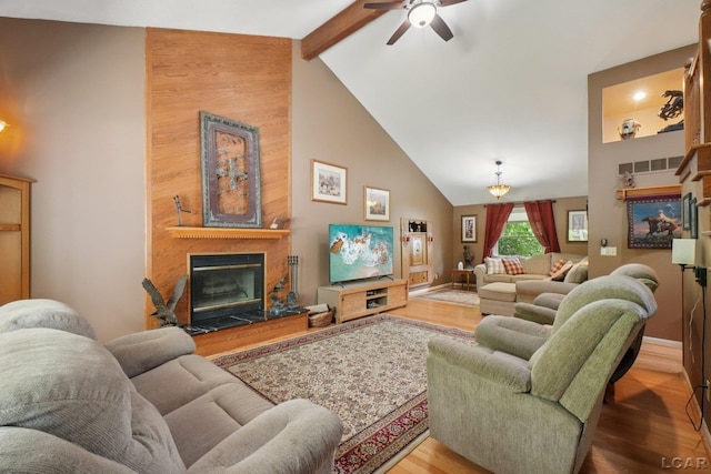 221 Burt St, Tecumseh, MI 49286 - living room featuring a high end fireplace, wood finished floors, a ceiling fan, high vaulted ceiling, and beamed ceiling