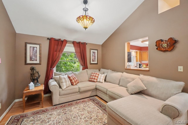 221 Burt St, Tecumseh, MI 49286 - living area featuring vaulted ceiling and light wood-style flooring