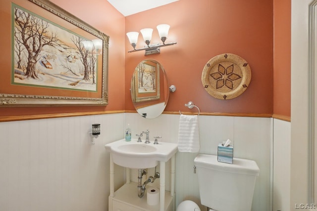 221 Burt St, Tecumseh, MI 49286 - half bath with a wainscoted wall and toilet