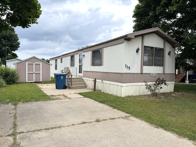 8836 Stevensville Baroda Rd Lot 135, Baroda, MI 49101 - manufactured / mobile home featuring a storage shed and a front lawn