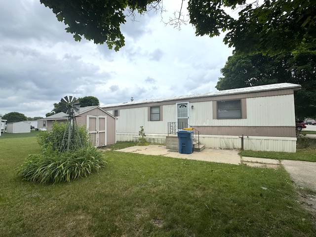 8836 Stevensville Baroda Rd Lot 135, Baroda, MI 49101 - view of front of home with a storage unit and a front yard