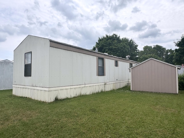 8836 Stevensville Baroda Rd Lot 135, Baroda, MI 49101 - view of side of property with a yard and an outdoor structure