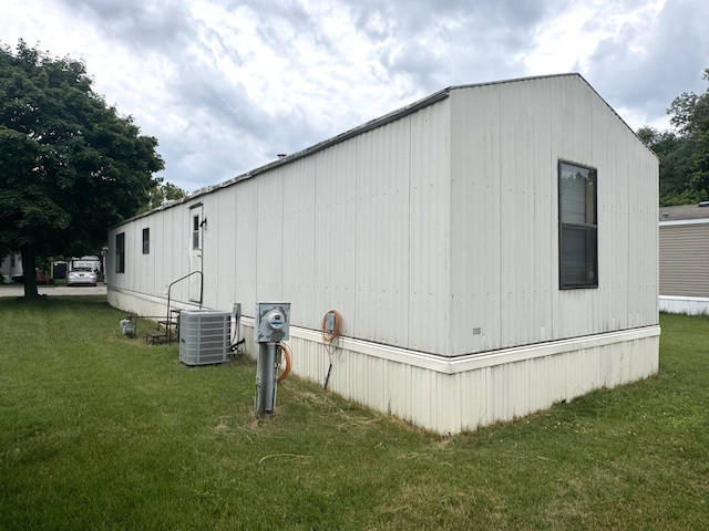 8836 Stevensville Baroda Rd Lot 135, Baroda, MI 49101 - view of property exterior featuring a central air condition unit and a yard