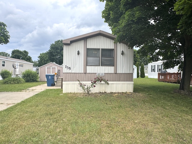 8836 Stevensville Baroda Rd Lot 135, Baroda, MI 49101 - manufactured / mobile home featuring a front lawn and a shed