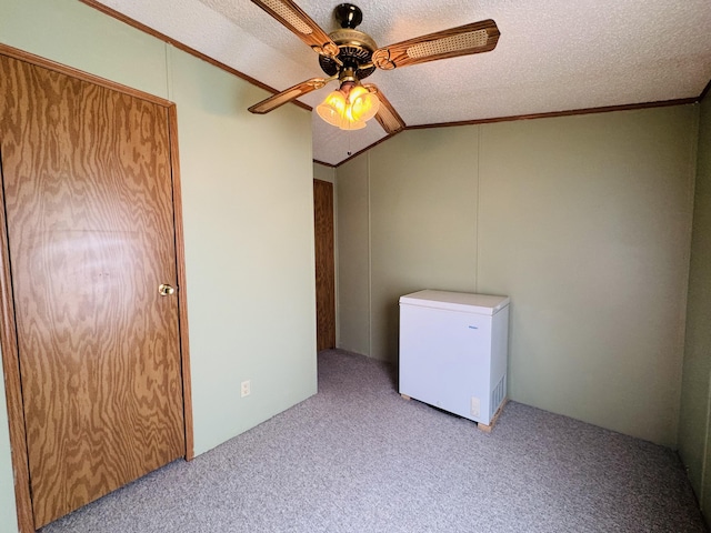 8836 Stevensville Baroda Rd Lot 135, Baroda, MI 49101 - unfurnished bedroom with white fridge, carpet flooring, ornamental molding, a textured ceiling, and ceiling fan