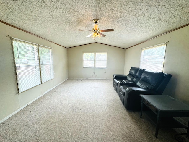 8836 Stevensville Baroda Rd Lot 135, Baroda, MI 49101 - living area featuring lofted ceiling, a ceiling fan, crown molding, carpet, and a textured ceiling