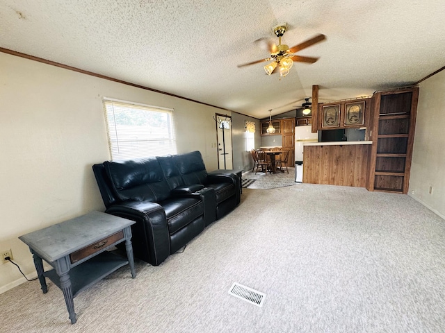 8836 Stevensville Baroda Rd Lot 135, Baroda, MI 49101 - living area featuring ceiling fan, vaulted ceiling, light colored carpet, ornamental molding, and a textured ceiling
