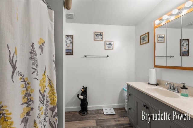 17122 Kent Ave, Morley, MI 49336 - full bath with vanity, wood finished floors, and curtained shower