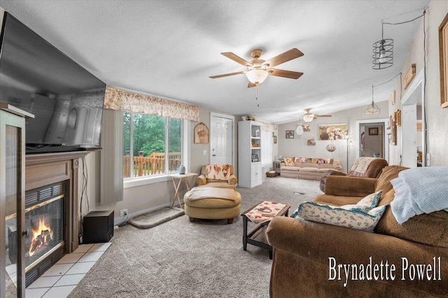 17122 Kent Ave, Morley, MI 49336 - living area with a ceiling fan, a fireplace with flush hearth, and light carpet