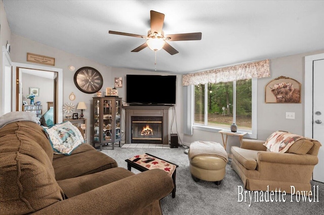 17122 Kent Ave, Morley, MI 49336 - carpeted living area featuring ceiling fan, a fireplace with flush hearth, and lofted ceiling