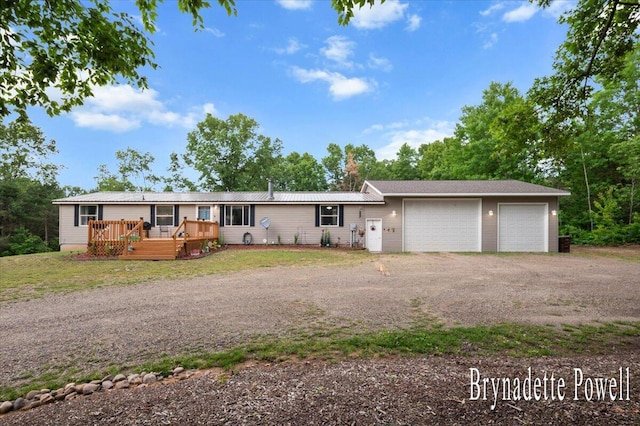 17122 Kent Ave, Morley, MI 49336 - view of front of home featuring an attached garage, driveway, and a deck