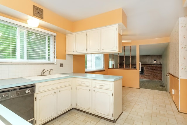 18210 Rainbow Dr, Lathrup Village, MI 48076 - kitchen featuring dishwasher, plenty of natural light, a peninsula, white cabinetry, and wallpapered walls
