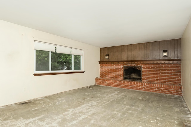 18210 Rainbow Dr, Lathrup Village, MI 48076 - unfurnished living room featuring a brick fireplace and wooden walls